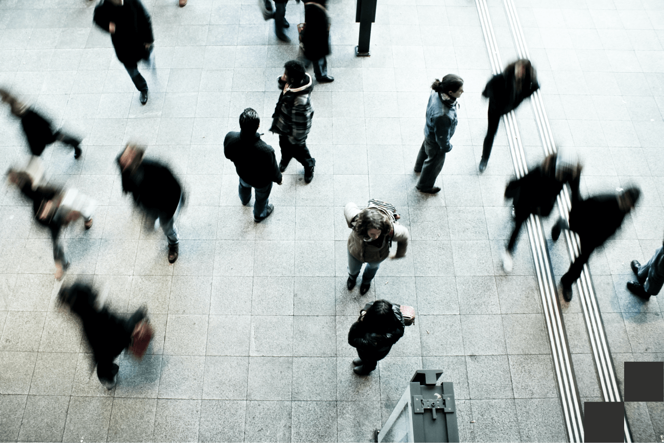 People walking across a floor