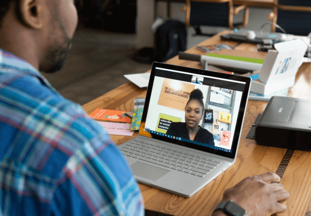 A person video chatting with another person via laptop