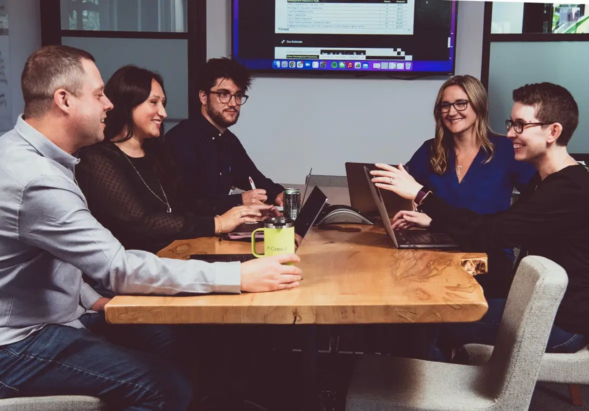 Five coworkers in a conference room