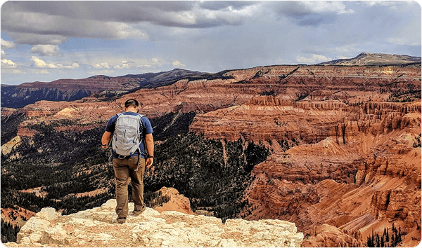 Man on top of mountain range.