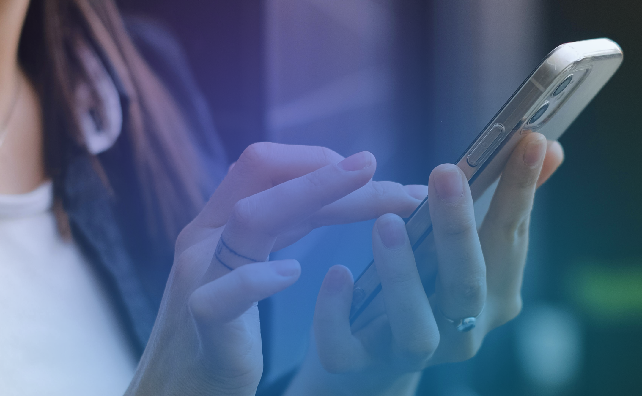 User interacting with cell phone.