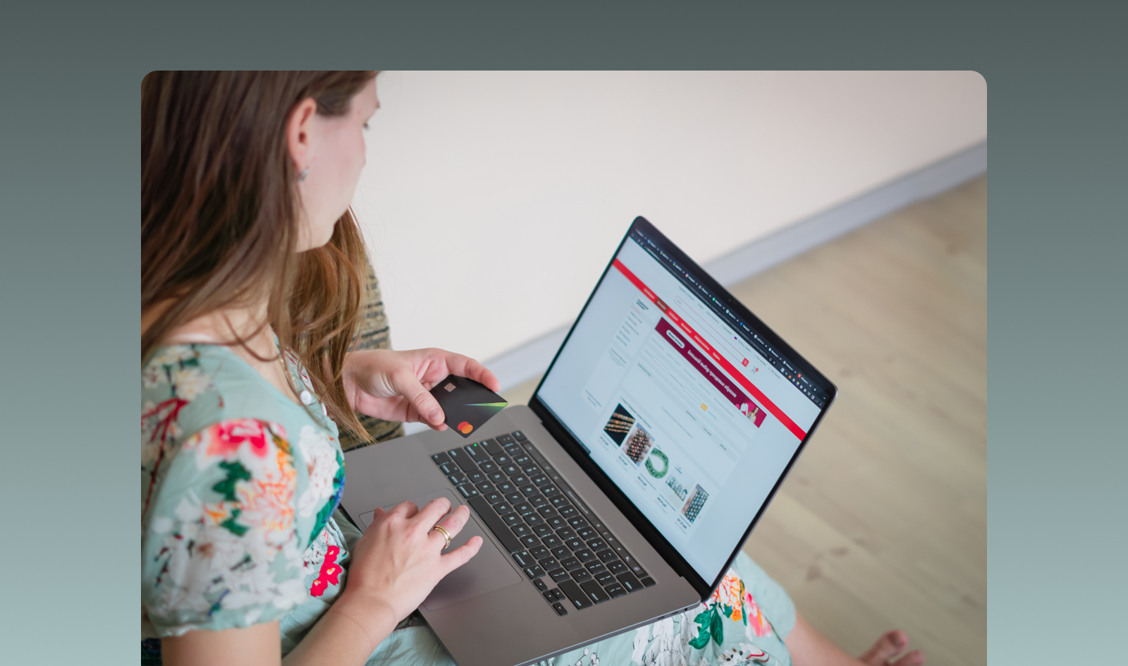 woman with laptop and credit card in hand