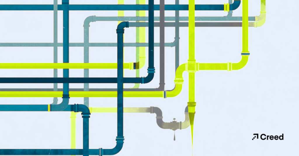 pipes connecting in various directions, with one spot leaking