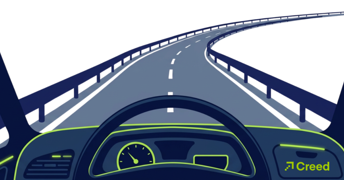 Graphic of steering wheel and dashboard heading down curved road with guardrails